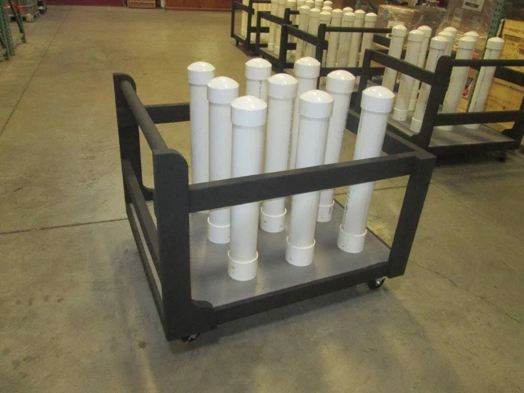 Industrial storage cart with white cylindrical containers for machinery or equipment storage.