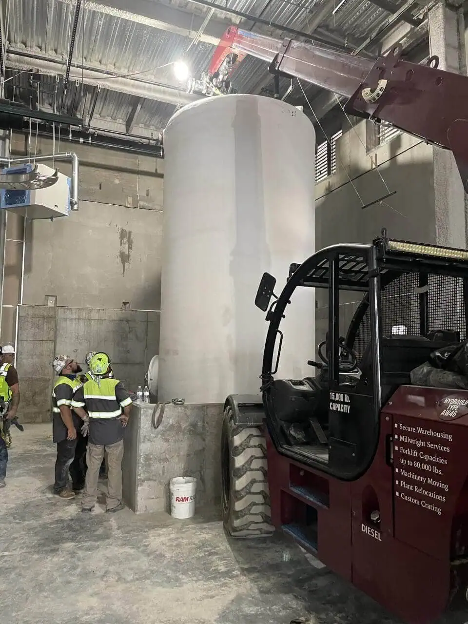 Heavy rigging and machinery moving of a large fiberglass waste tank by MEI Industrial Solutions.