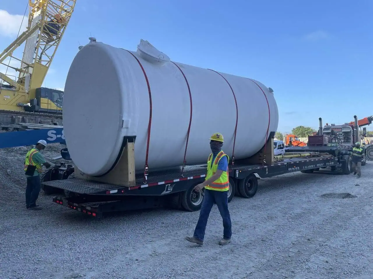 Heavy rigging and machinery moving of a large industrial storage tank by MEI Industrial Solutions.