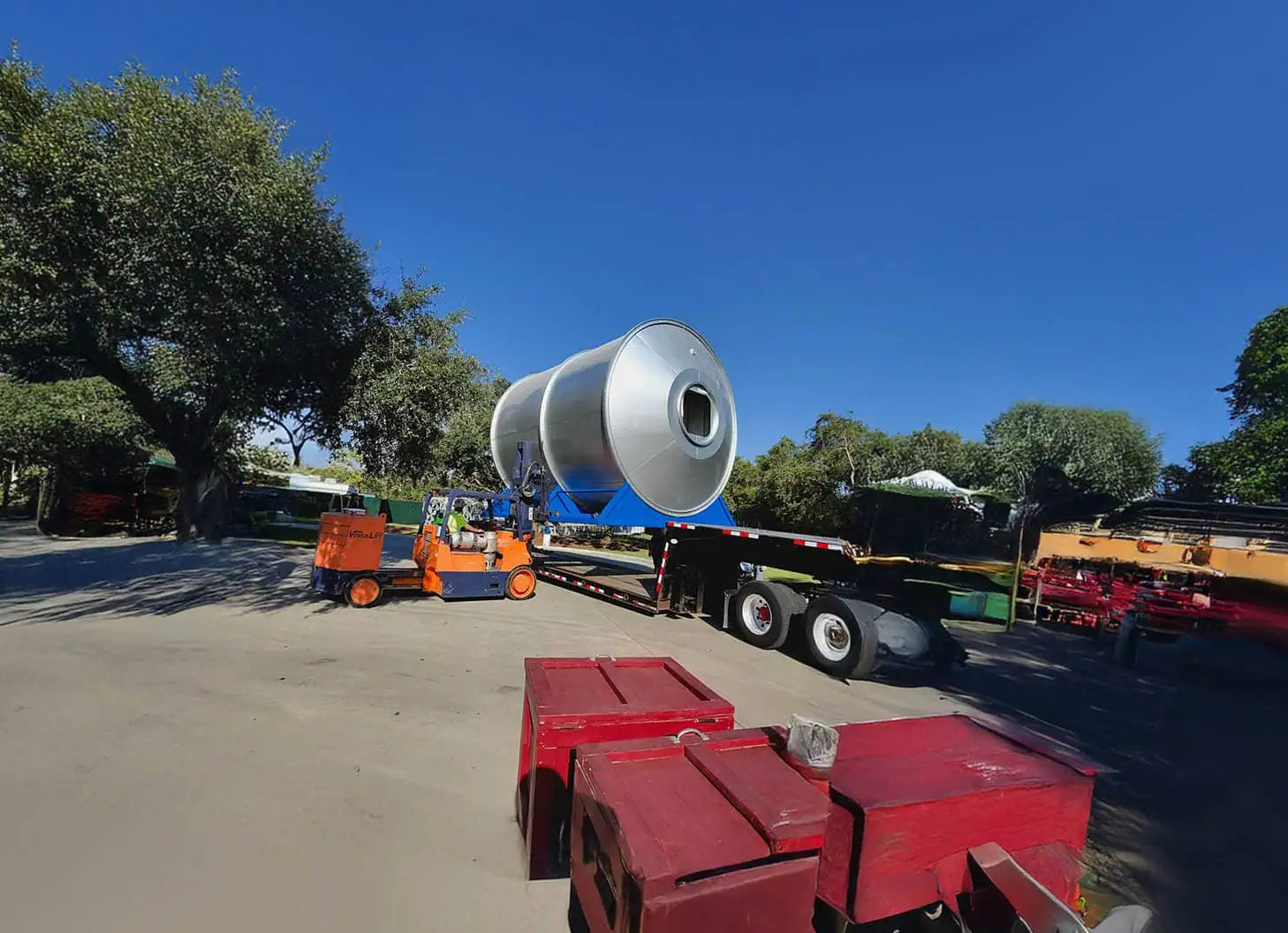 Large industrial equipment being moved using heavy rigging and specialized transportation by MEI.